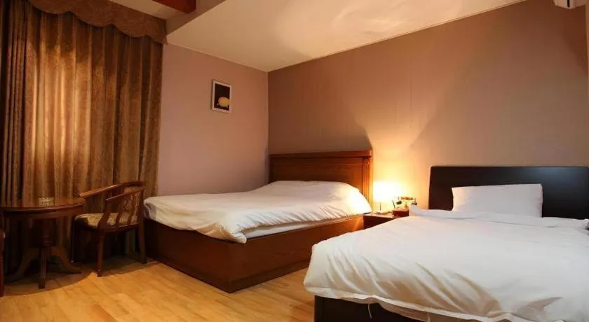 Bed in Monaco Hotel Jeju