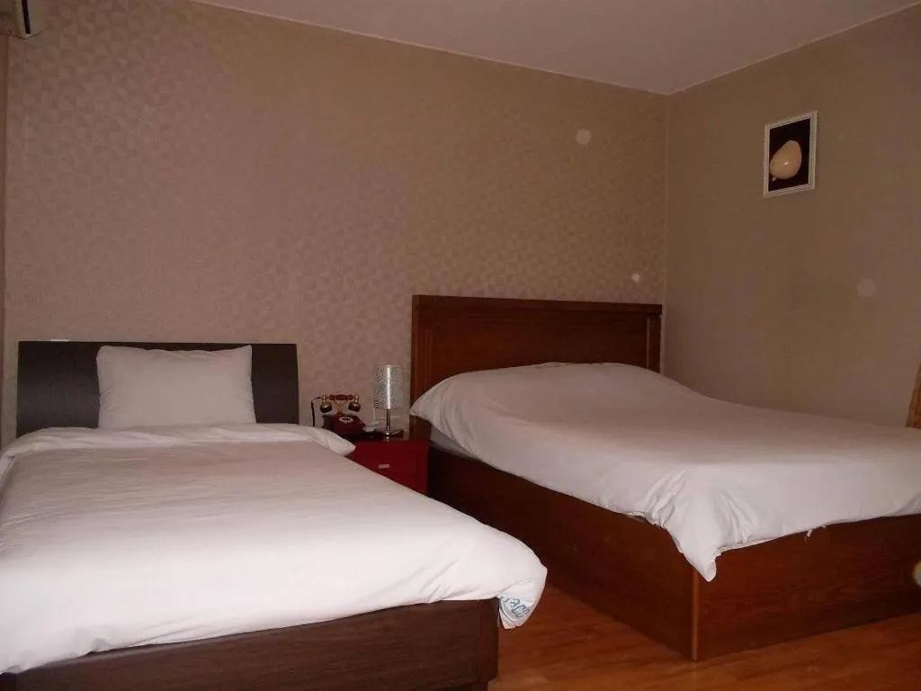 Bed in Monaco Hotel Jeju