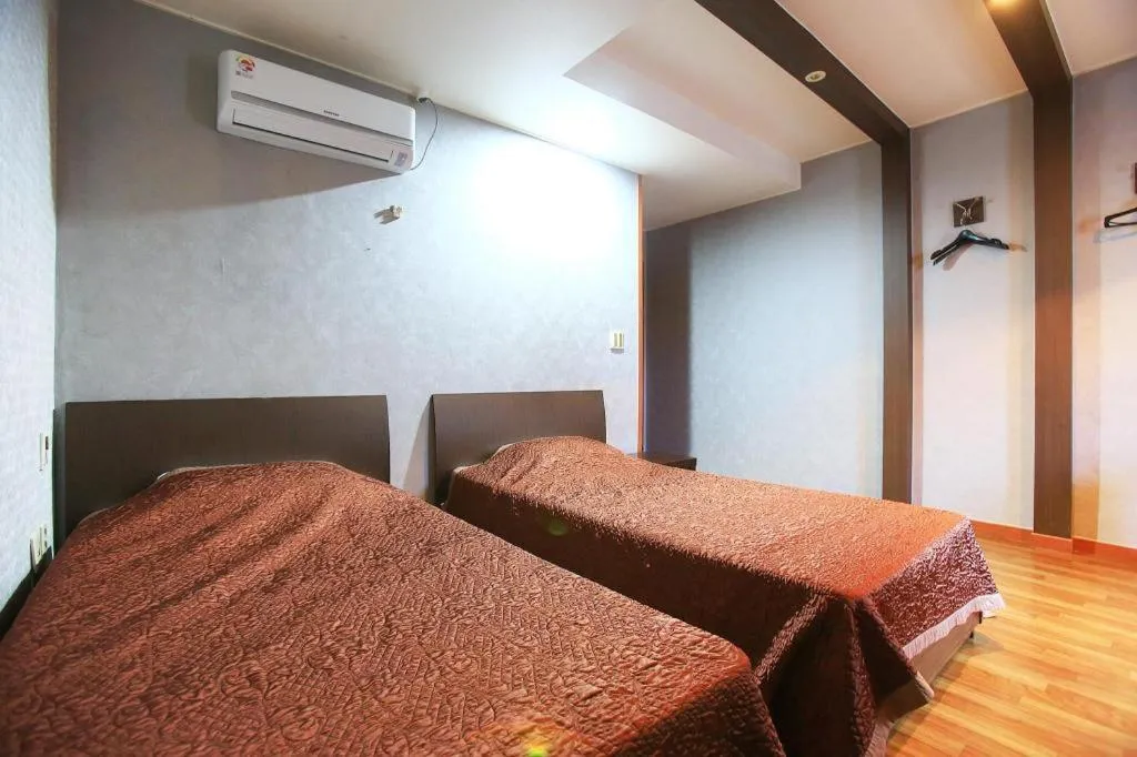 Bed in Monaco Hotel Jeju