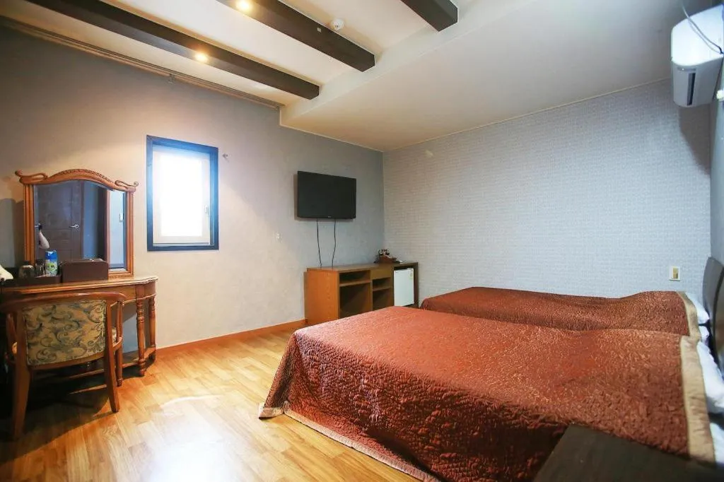 Bed in Monaco Hotel Jeju