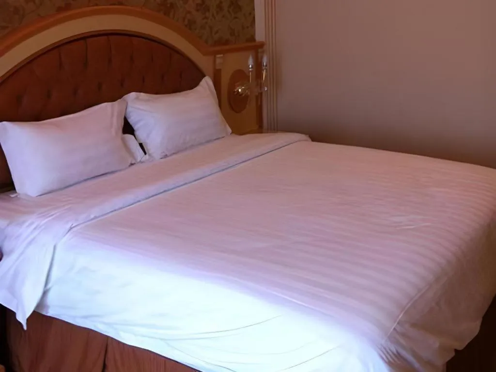 Bed in Hotel Grand Town