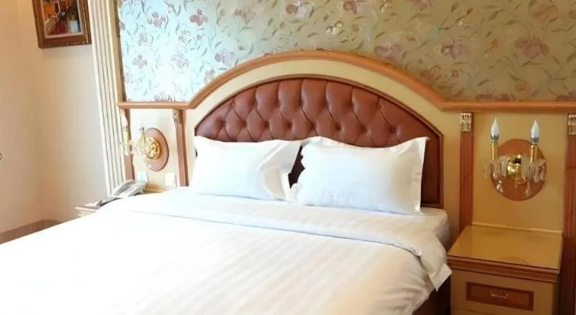 Bed in Hotel Grand Town