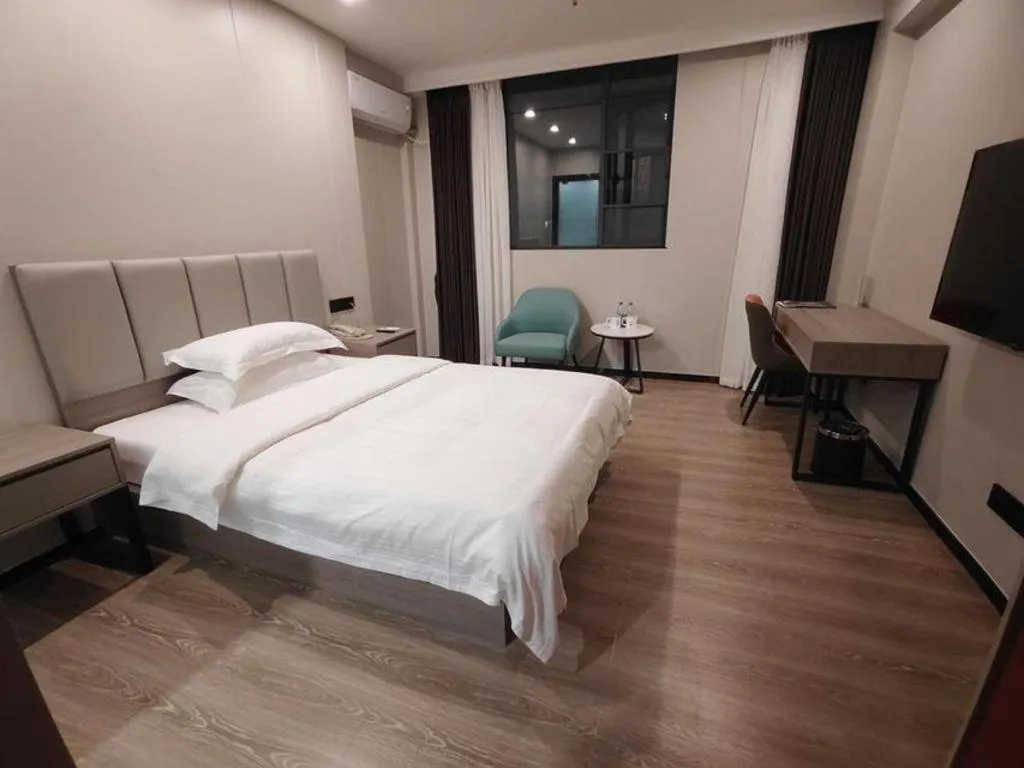 Bed in GreenTree Inn Shenzhen Kengzi Town Express Hotel