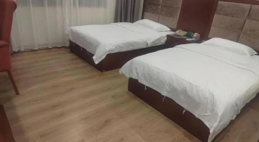 Bed in GreenTree Inn Shenzhen Kengzi Town Express Hotel