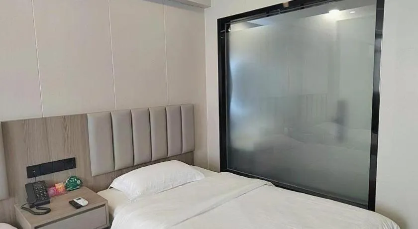 Bed in GreenTree Inn Shenzhen Kengzi Town Express Hotel