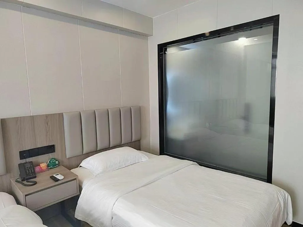 Bed in GreenTree Inn Shenzhen Kengzi Town Express Hotel