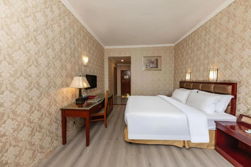 Bed in Zhenxing Hotel