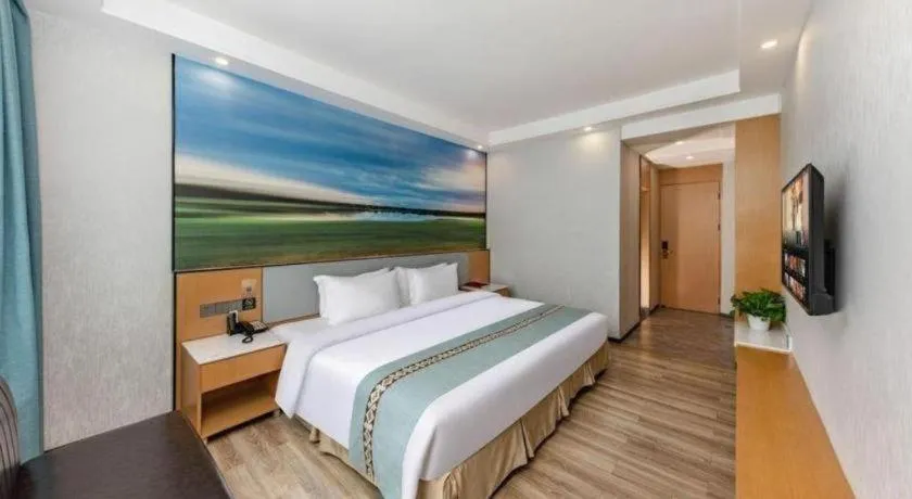 Bed in Zhenxing Hotel