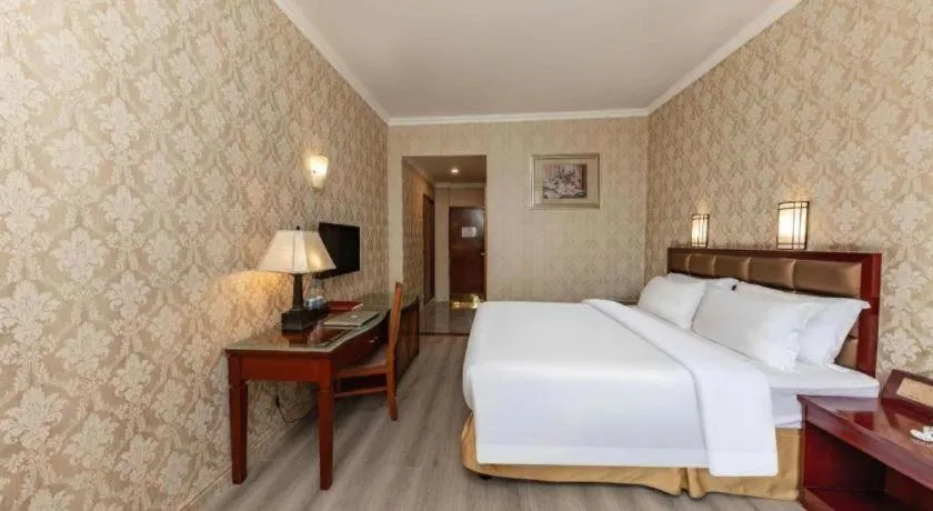 Bed in Zhenxing Hotel