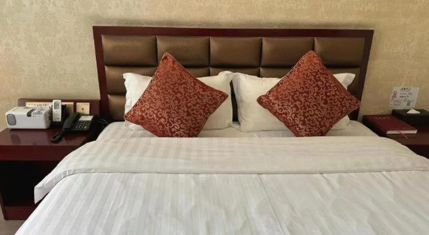 Bed in Zhenxing Hotel