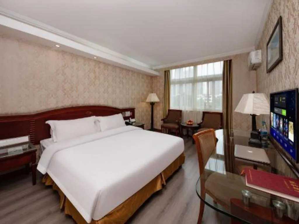 Bed in Zhenxing Hotel