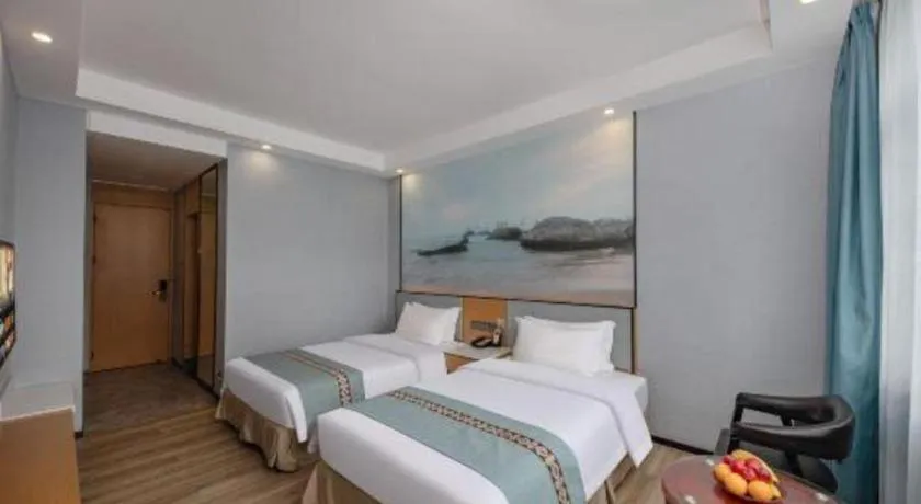 Bed in Zhenxing Hotel