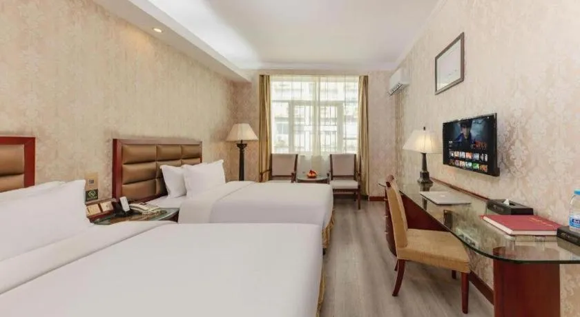 Bed in Zhenxing Hotel