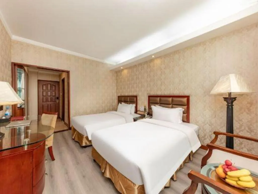 Bed in Zhenxing Hotel