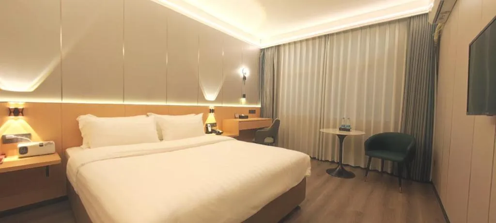 Bed in Zhenxing Hotel
