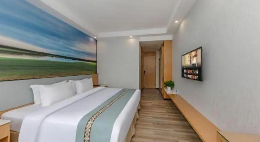 Bed in Zhenxing Hotel