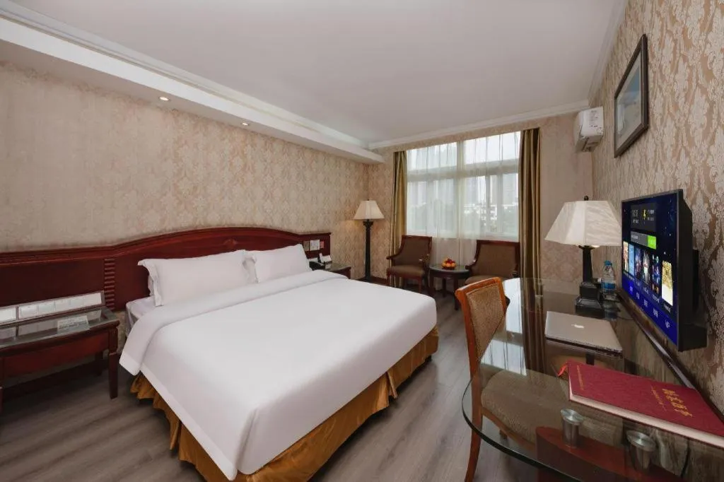 Bed in Zhenxing Hotel