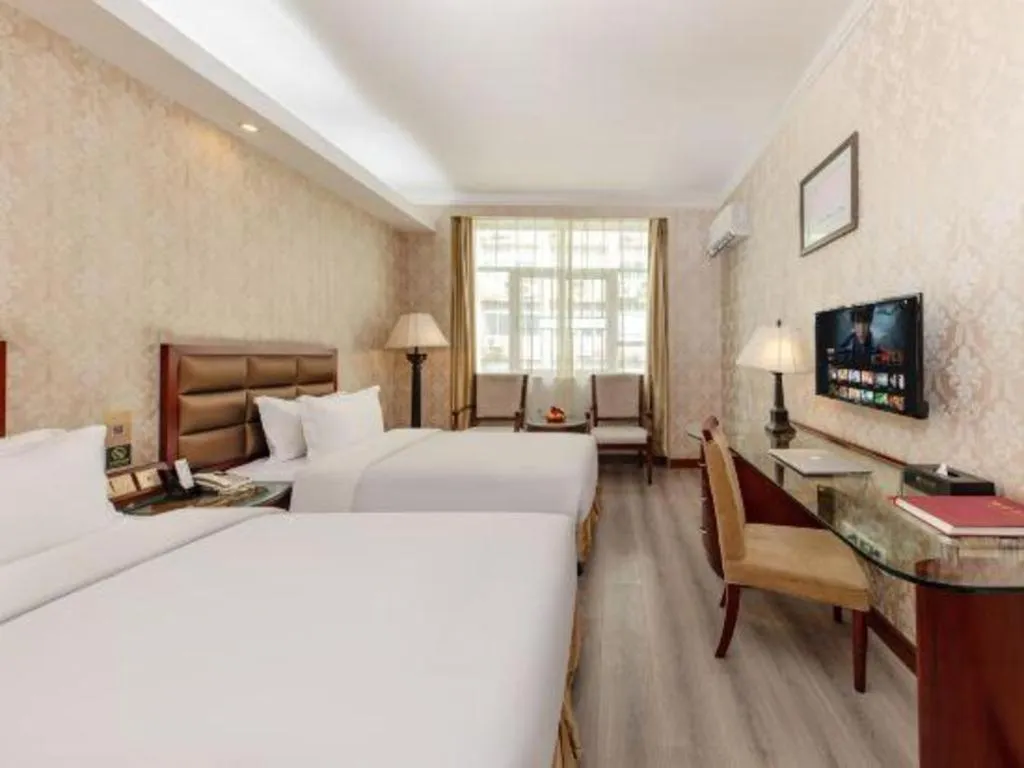 Bed in Zhenxing Hotel