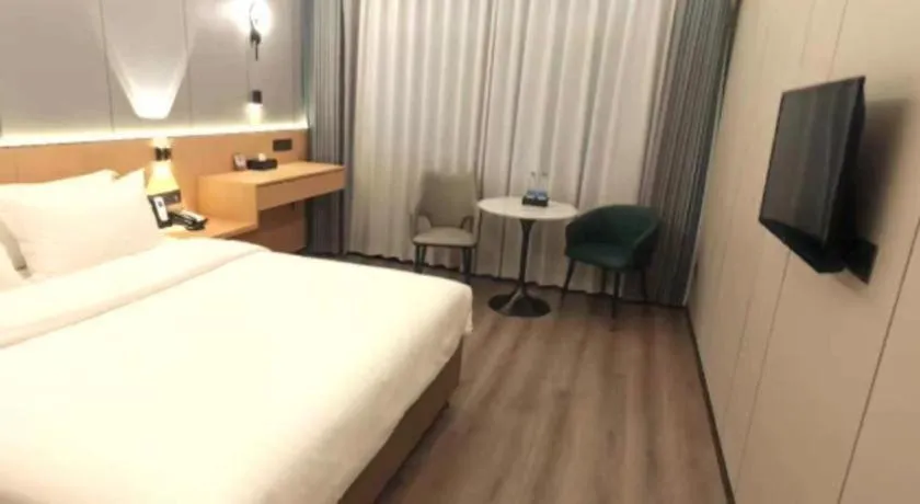 Bed in Zhenxing Hotel