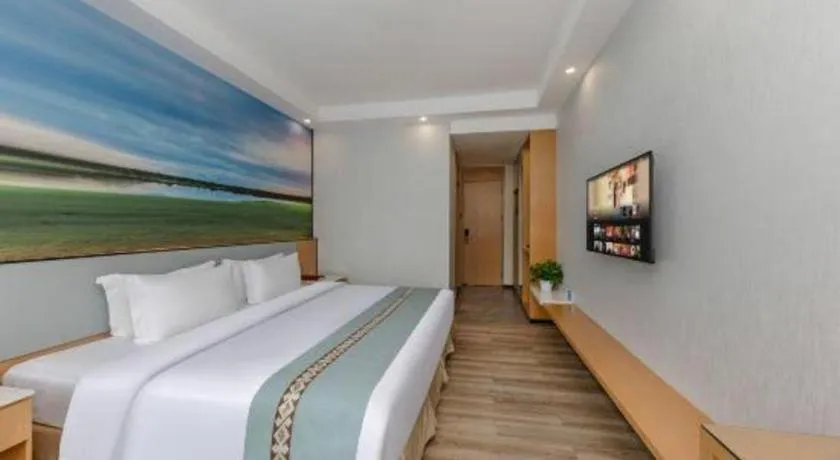 Bed in Zhenxing Hotel