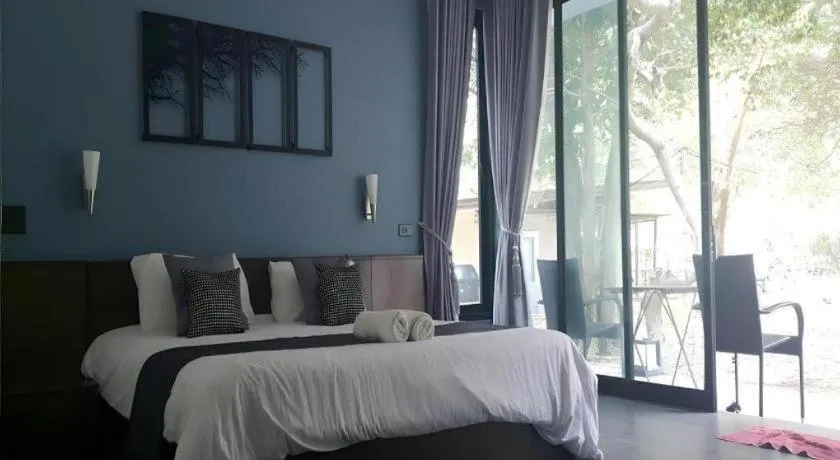 Bed in Baan Chao Mai Beach House