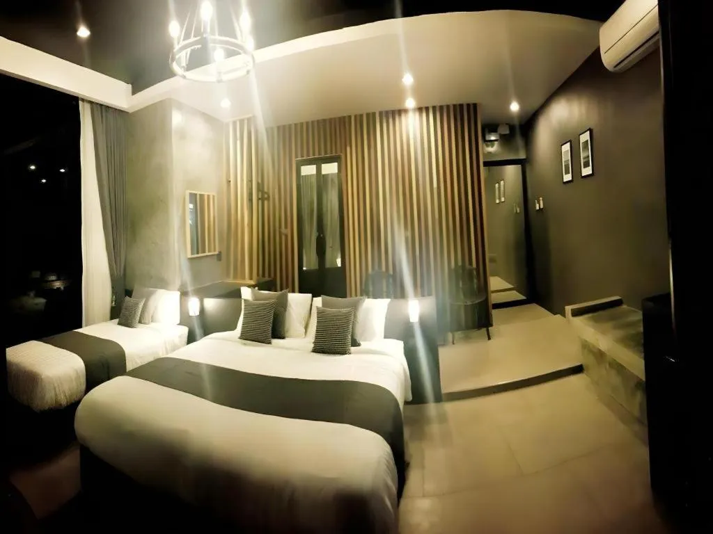 Bed in Baan Chao Mai Beach House