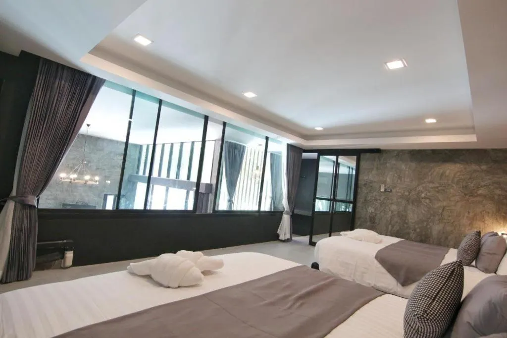 Bed in Baan Chao Mai Beach House