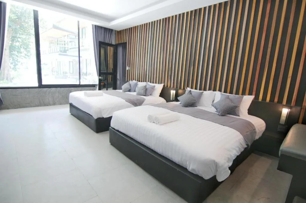 Bed in Baan Chao Mai Beach House