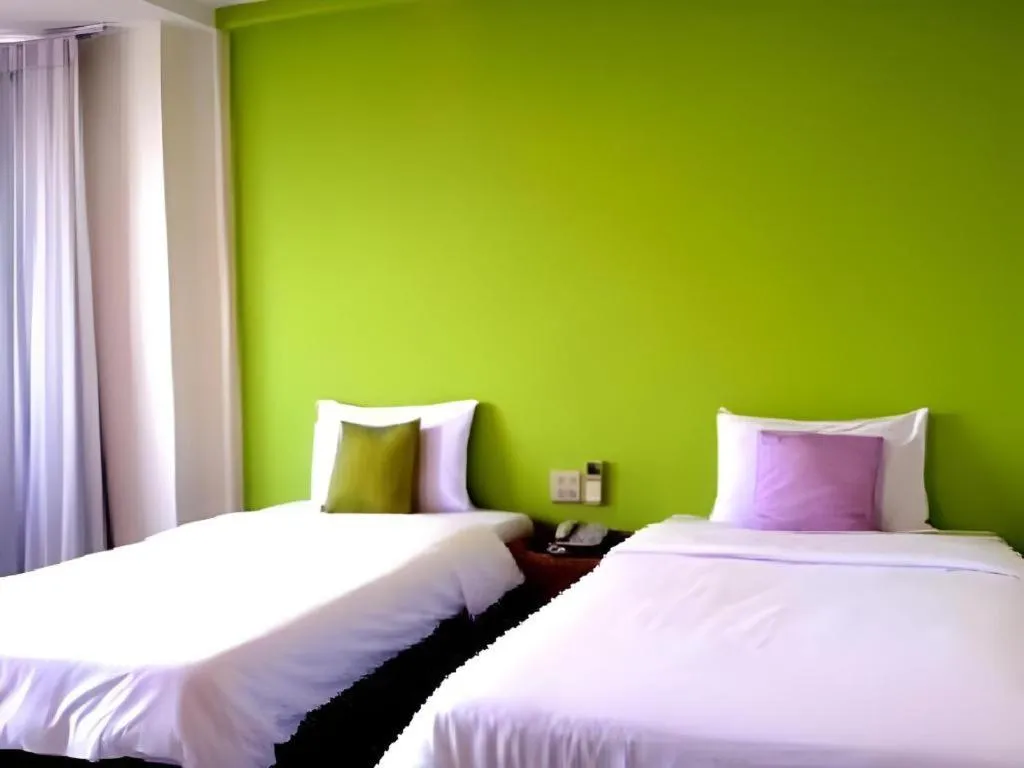 Bed in The Majestic Sakon Nakhon Hotel