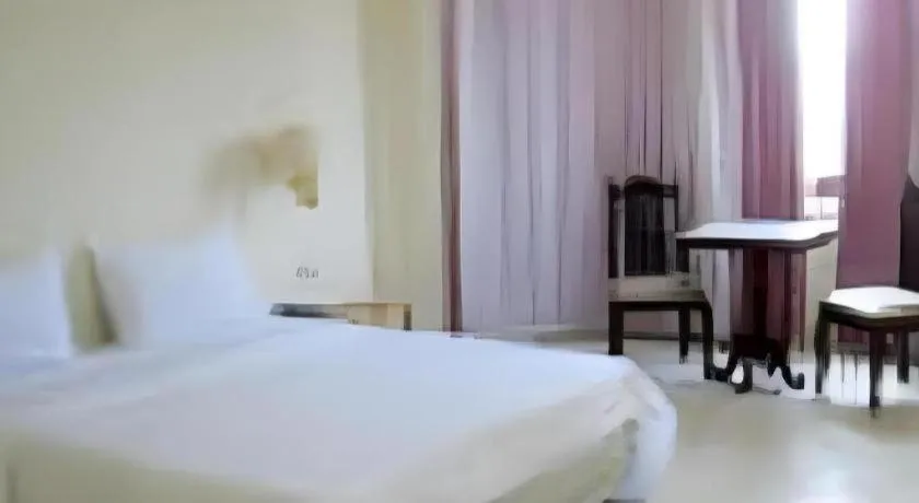 Bed in The Majestic Sakon Nakhon Hotel