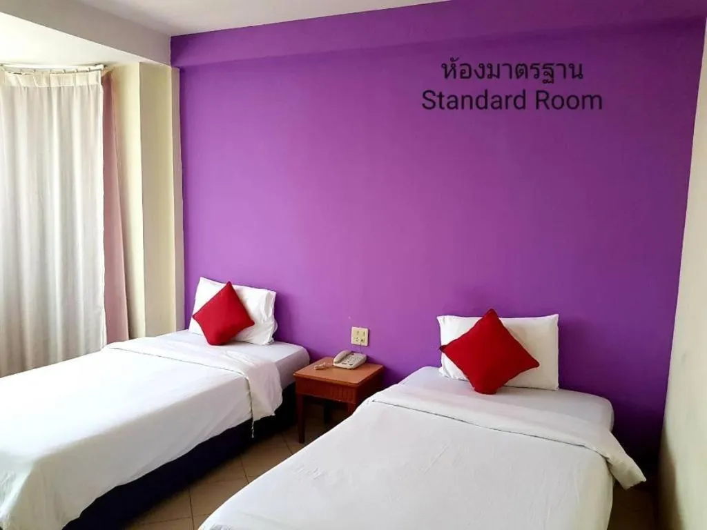 Bed in The Majestic Sakon Nakhon Hotel