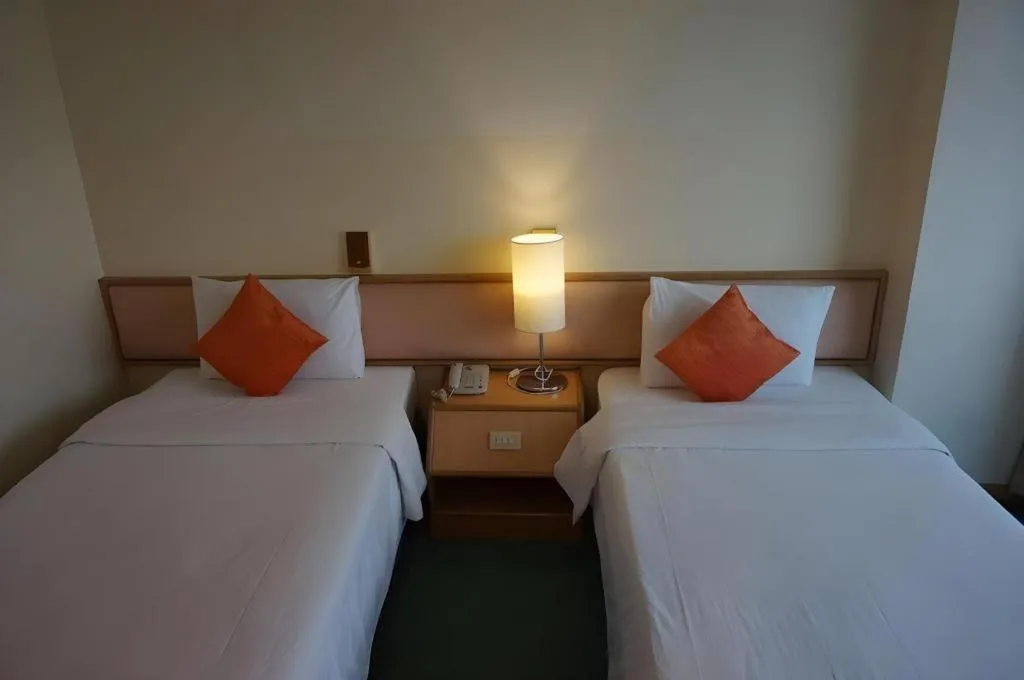 Bed in The Majestic Sakon Nakhon Hotel