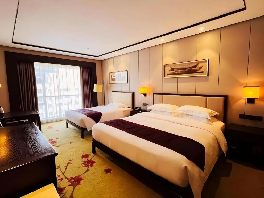 Bed in Xiang Yun Sha Garden Hotel