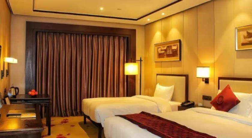 Bed in Xiang Yun Sha Garden Hotel