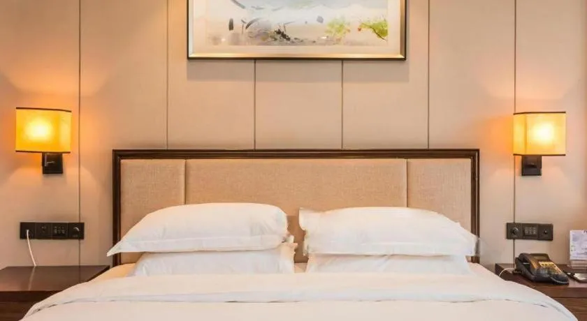 Bed in Xiang Yun Sha Garden Hotel