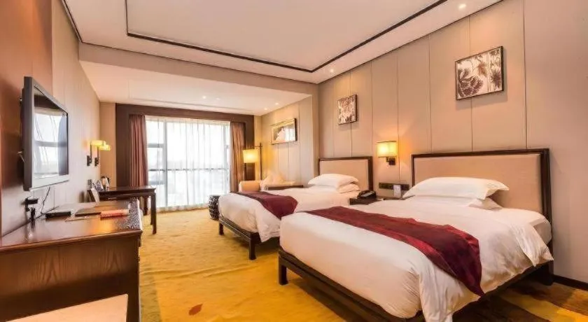 Bed in Xiang Yun Sha Garden Hotel