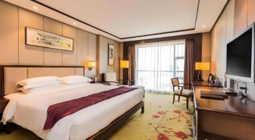 Bed in Xiang Yun Sha Garden Hotel