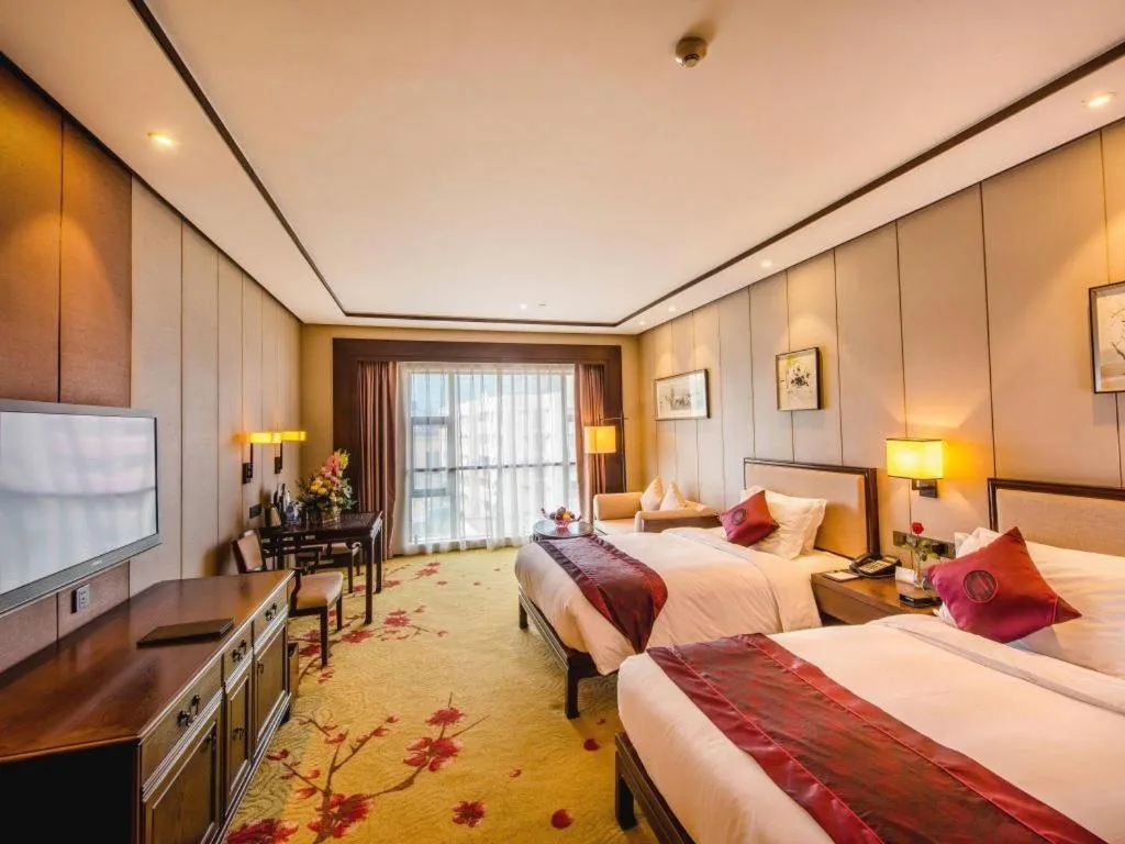 Bed in Xiang Yun Sha Garden Hotel