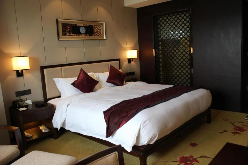 Bed in Xiang Yun Sha Garden Hotel