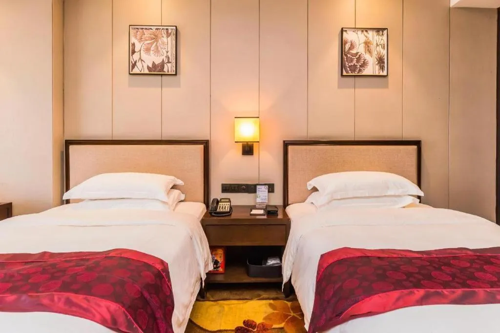 Bed in Xiang Yun Sha Garden Hotel