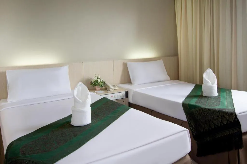 Bed in Hatyai Rama Hotel