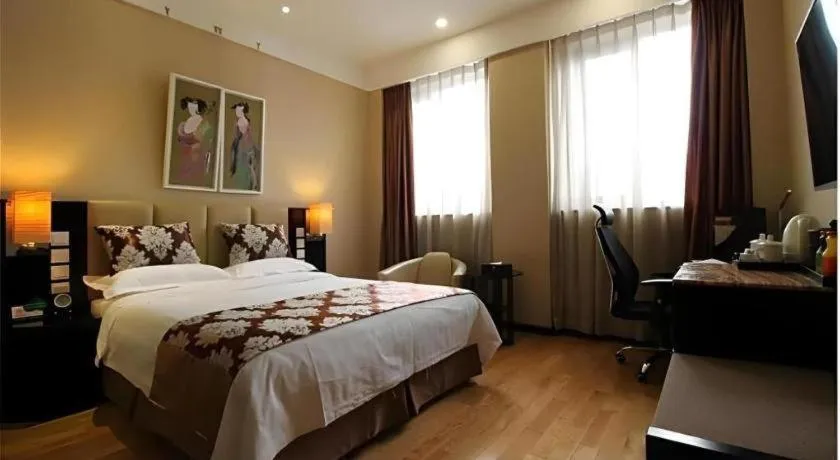 Bed in AC Embassy Hotel