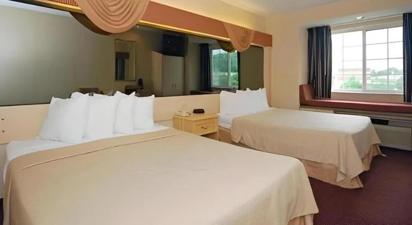 Bed in Quality Inn & Suites