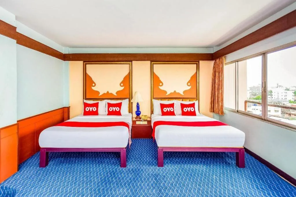 Bed in OYO 441 Grand Thara Hotel