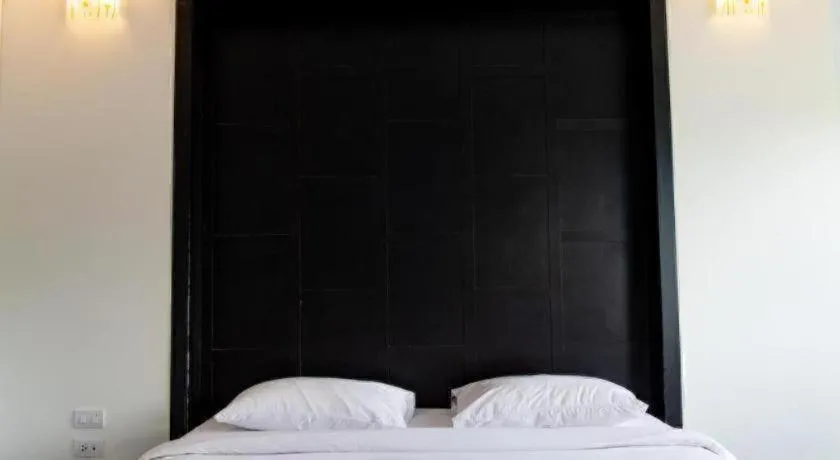 Bed in Baan Ingna Resort Hotel