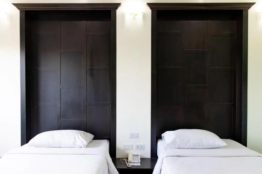 Bed in Baan Ingna Resort Hotel