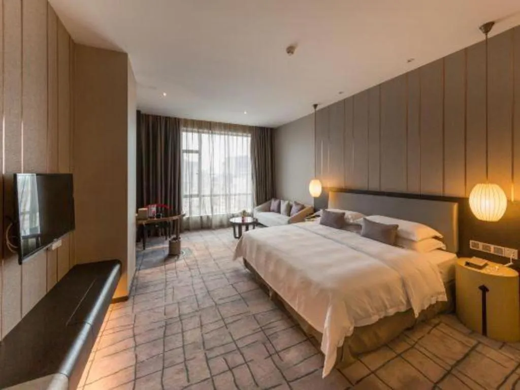 Bed in DongGuan JOYC Hotel 