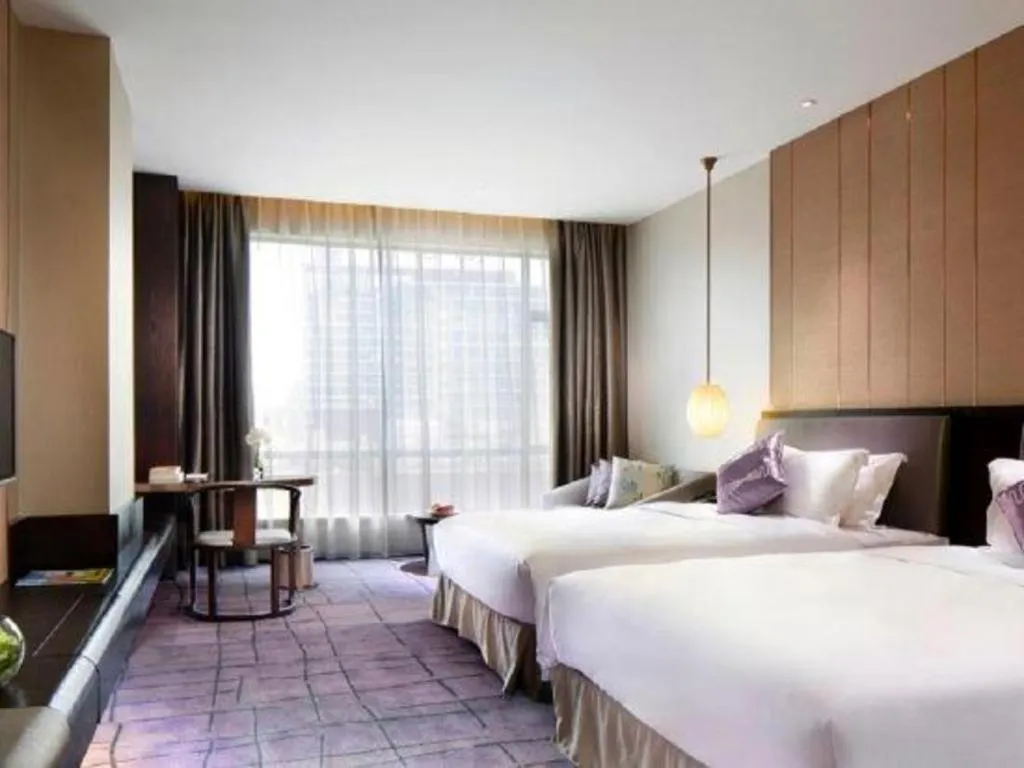 Bed in DongGuan JOYC Hotel 