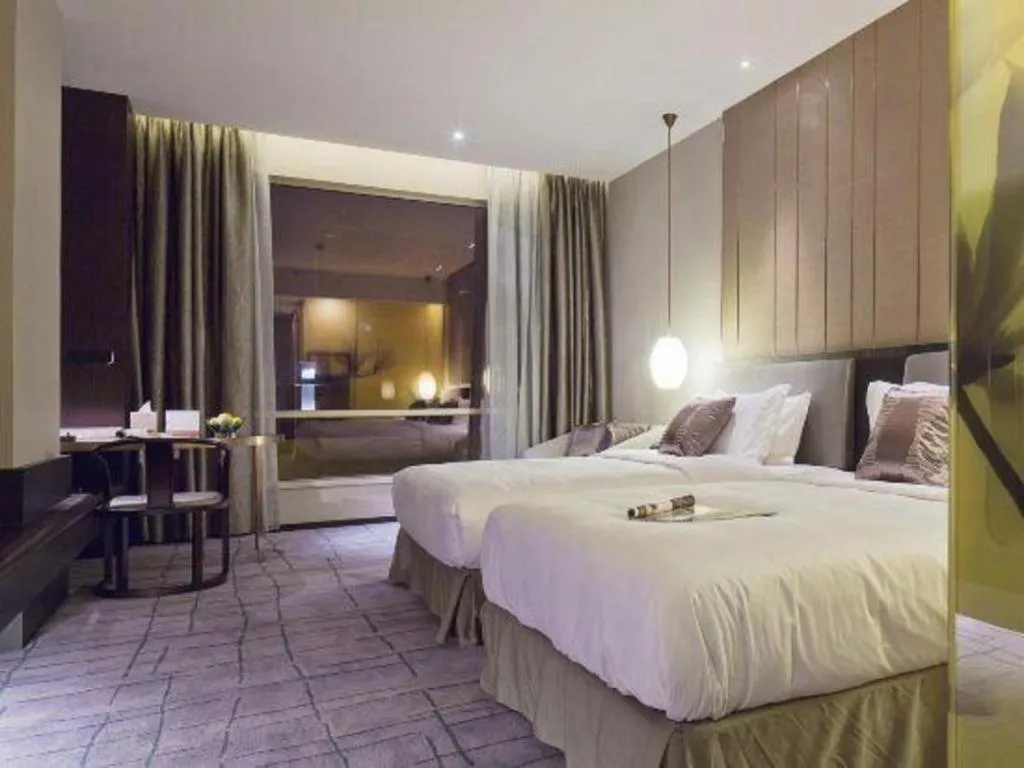 Bed in DongGuan JOYC Hotel 