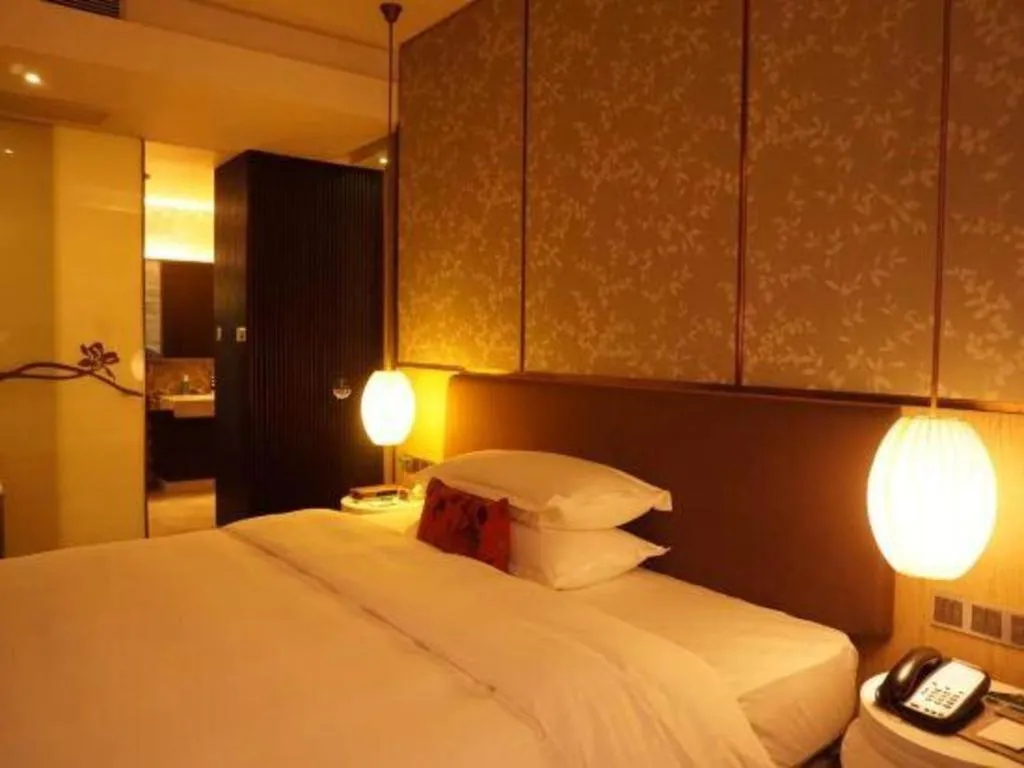 Bed in DongGuan JOYC Hotel 